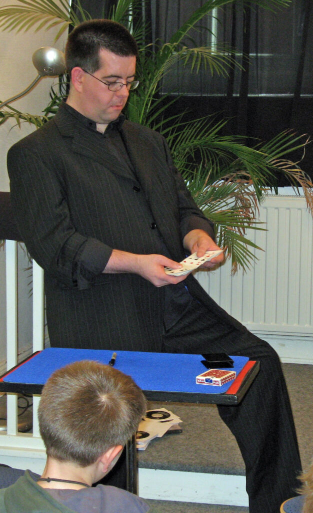 Magician Peter McLanachan, The Cardman, presenting his magic lecture.